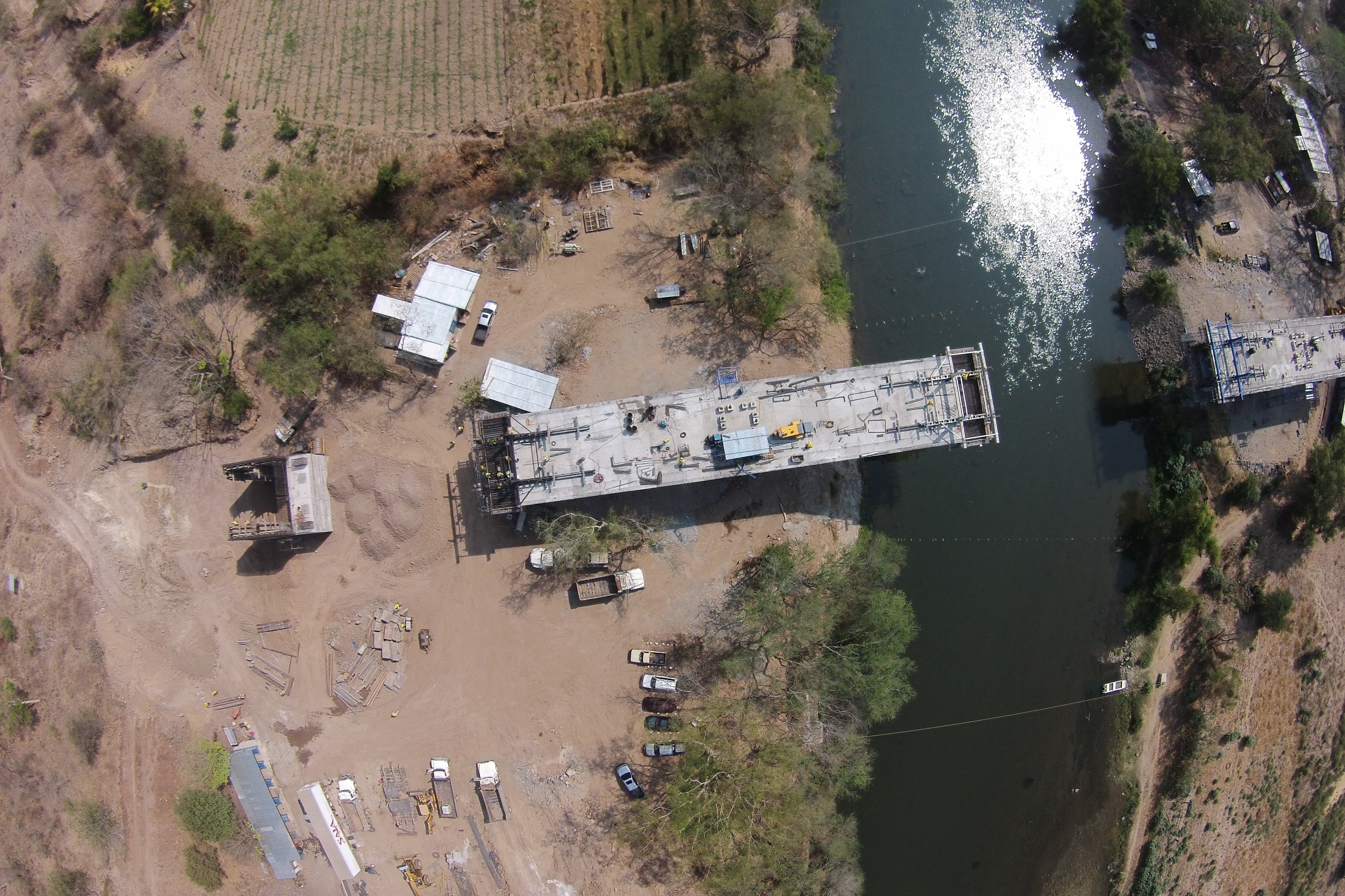 aerial-shot-construction-process-bridge-river